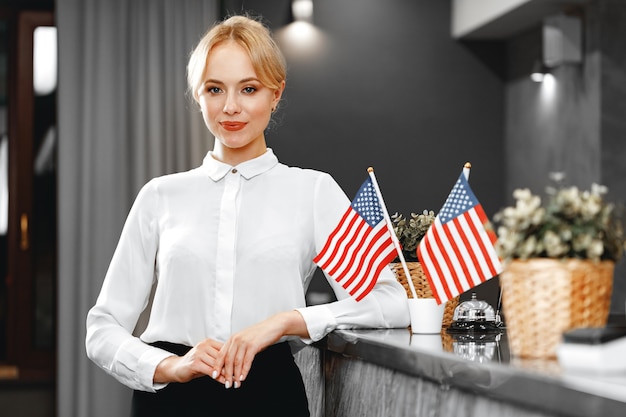 Portrait of beautiful blonde woman hotel receptionist close up