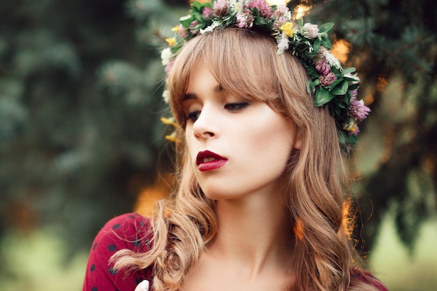 Portrait of beautiful blonde in wreath.