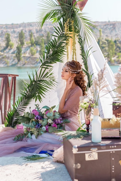 portrait of a beautiful bride on the background of a beautiful lake