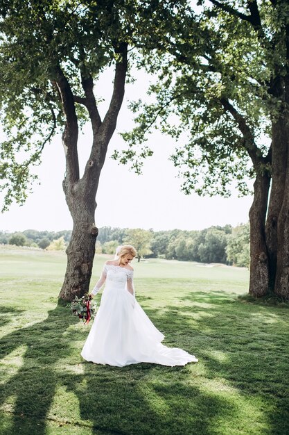 Portrait of a beautiful bride in nature