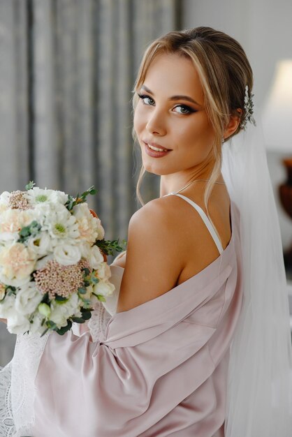 portrait of beautiful bride with bouquet of flowers