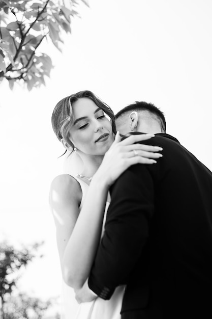 Portrait of beautiful bride with wedding bouquet Black and white photo