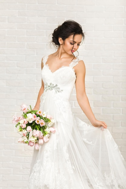 Portrait of beautiful bride with wedding bouquet