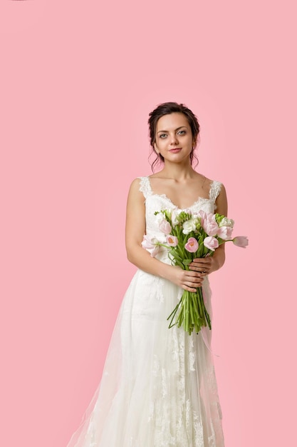 Portrait of beautiful bride with wedding bouquet