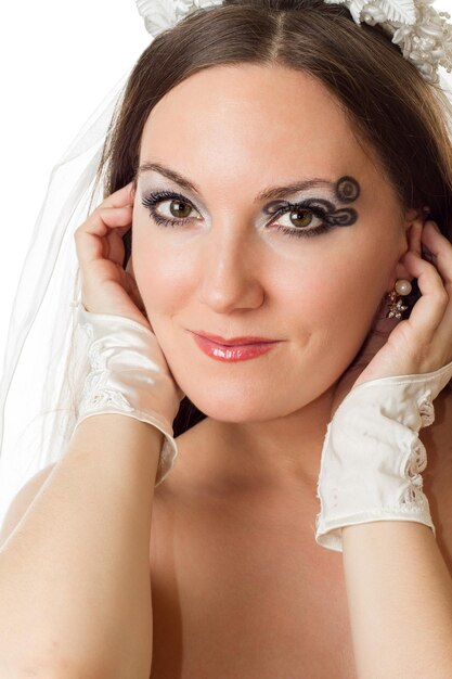 Portrait of beautiful bride woman with creative makeup and body art on white background Makeup fashion beauty