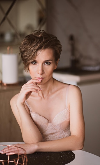 Portrait of a beautiful browneyed girl with a short haircut and makeup