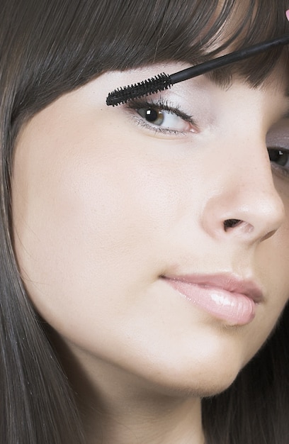 Portrait of Beautiful brunette woman doing daily morning routines (the make up series)