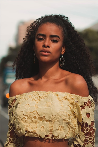 Portrait of a beautiful brunette woman with curly hair