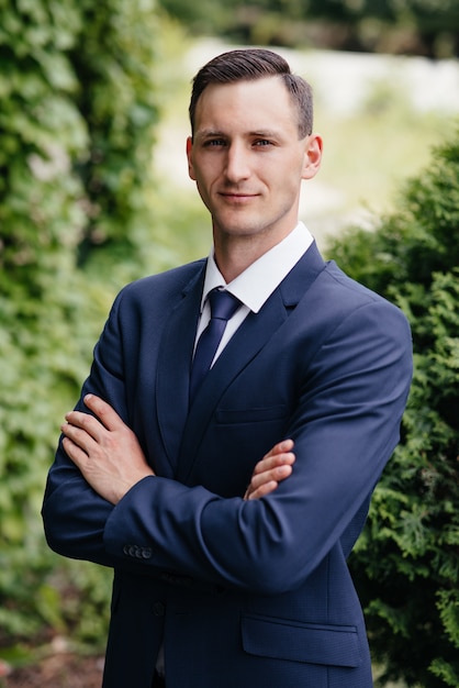 Portrait of a beautiful businessman in a blue suit