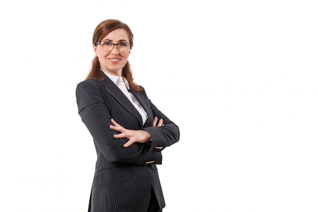 Portrait of a beautiful businesswoman 50 ears old in crossed arms pose isolated on white.