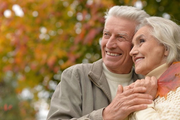 Portrait of beautiful caucasian senior couple hugging   in the park