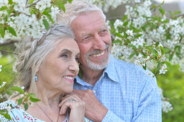 Portrait of beautiful caucasian senior couple in the park