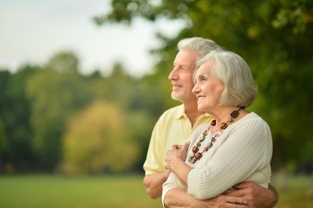 Portrait of beautiful caucasian senior couple in the park