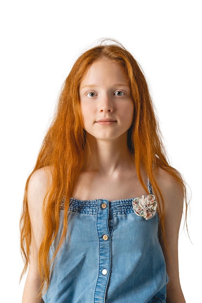 Portrait of beautiful cheerful redhead girl with long hair