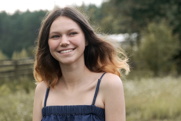 Portrait of beautiful cheerful smiling teenager girl 15 years old