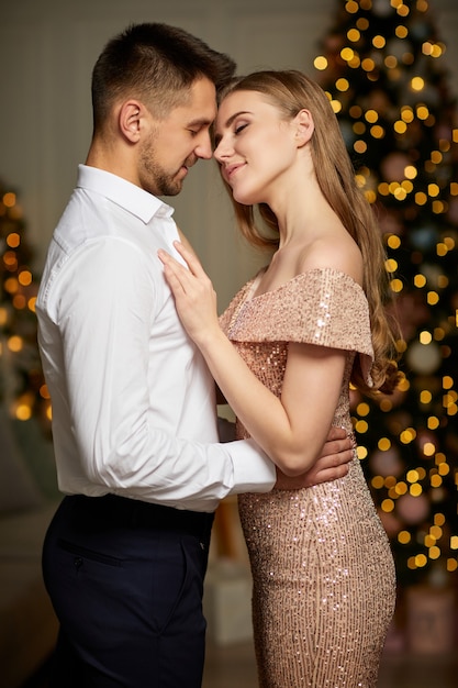 Portrait of beautiful couple celebrating Christmas together