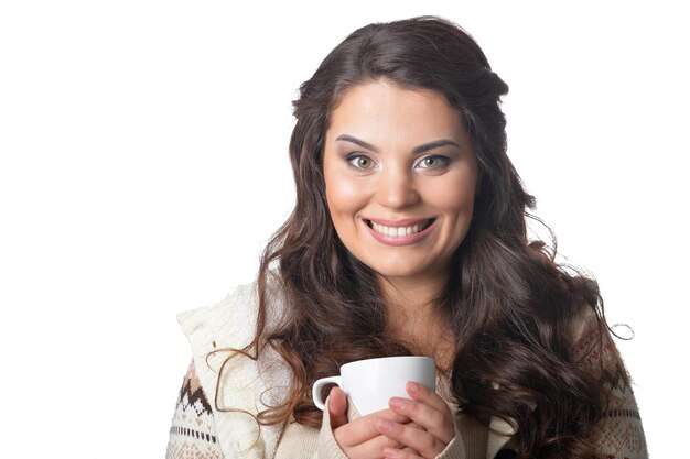 Portrait of beautiful curly woman wearing warm clothing on white background