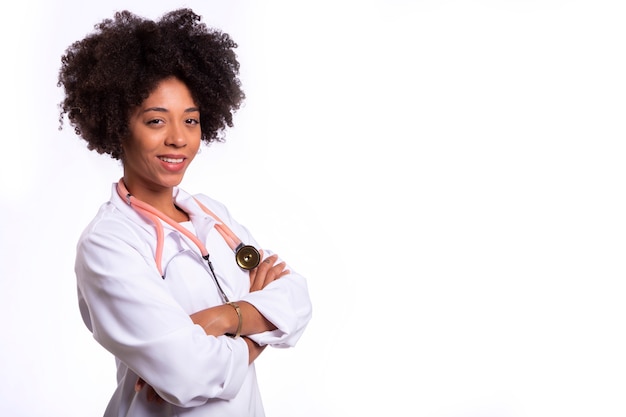 Portrait of beautiful doctor with arms crossed isolated over white background