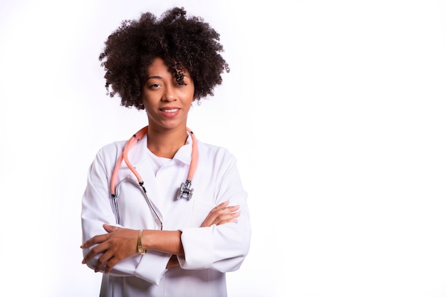 Portrait of beautiful doctor with arms crossed isolated over white background