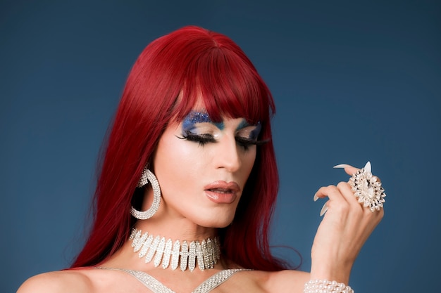 Photo portrait of beautiful drag person wearing makeup and wig