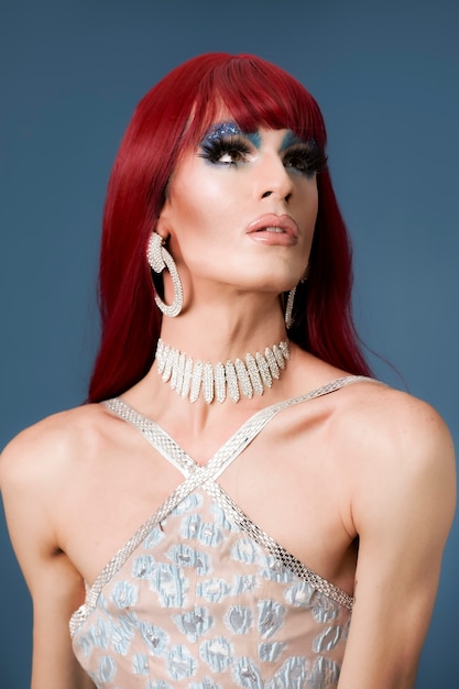 Photo portrait of beautiful drag person wearing makeup and wig