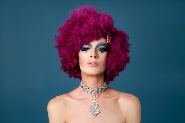 Photo portrait of beautiful drag person wearing makeup and wig