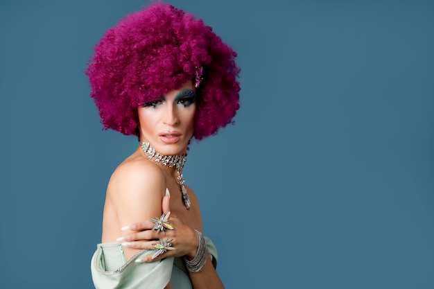 Photo portrait of beautiful drag person wearing makeup and wig