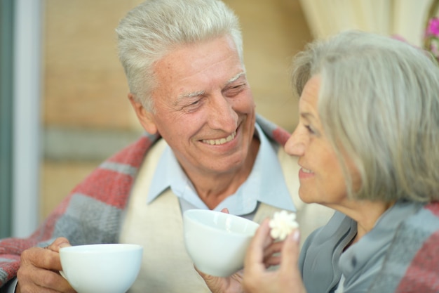 Portrait of a beautiful elderly couple standing outdoors