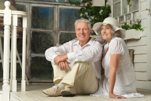 Portrait of beautiful elderly couple on veranda