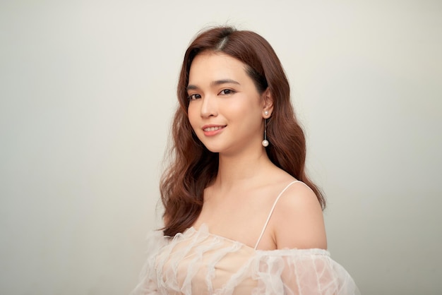 Portrait of beautiful elegant asian woman in white dress