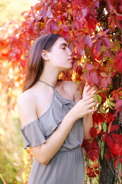 Portrait of a beautiful expressive brunette girl in nature