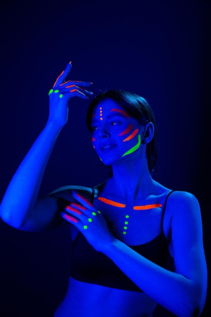 Portrait of Beautiful Fashion Woman in Neon UF Light