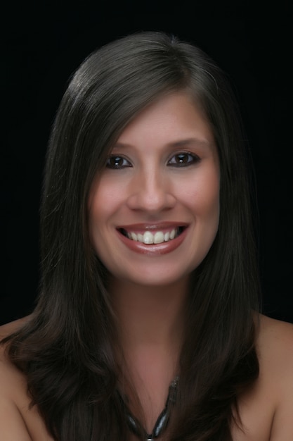 Portrait of beautiful female model on black background