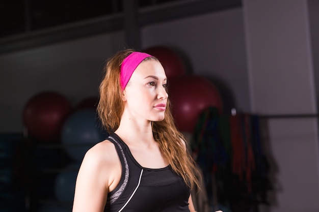 Portrait of beautiful fitness woman in gym