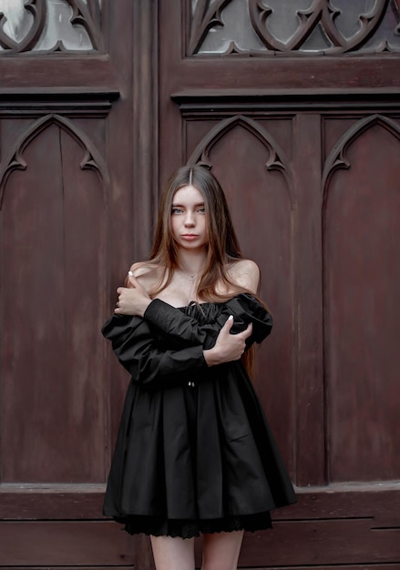 portrait of a beautiful girl on the background of beautiful doors