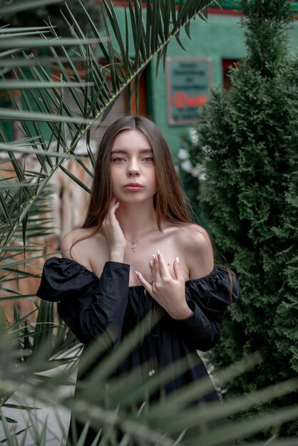 portrait of a beautiful girl on the background of a tree with flowers