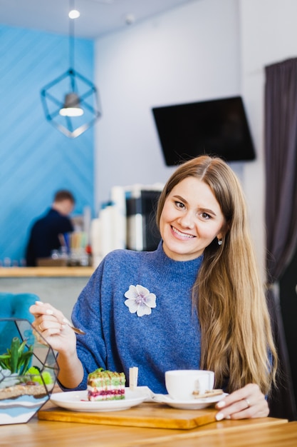 Portrait of a beautiful girl, european appearance in a cafe, beautiful interior