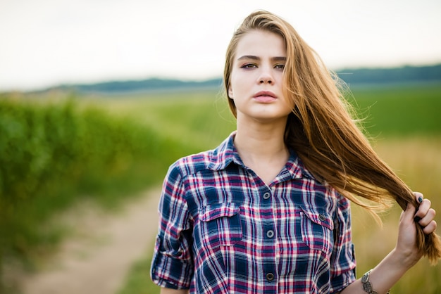 Portrait of a beautiful girl in a field