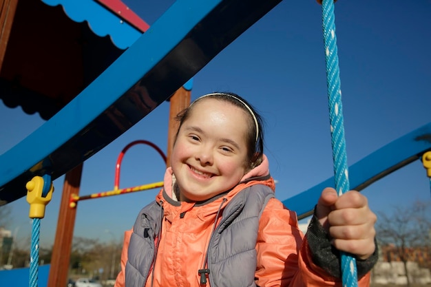 Portrait of beautiful girl on the playground