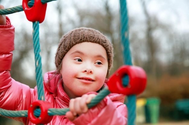 Portrait of beautiful girl on the playground