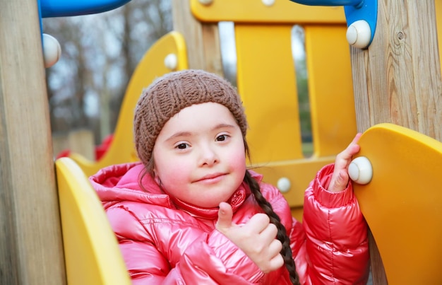 Portrait of beautiful girl on the playground