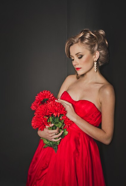 Photo portrait of the beautiful girl in a red dress 3327