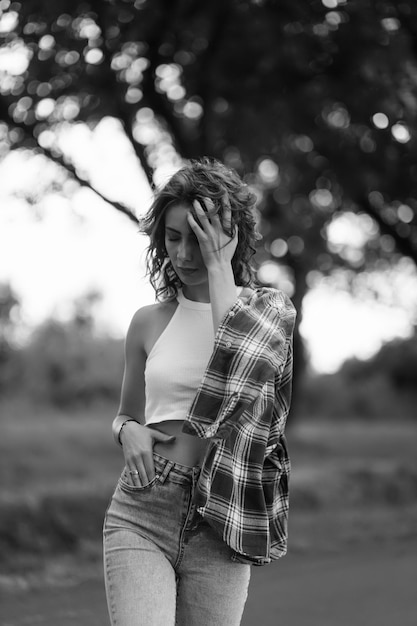 Photo portrait of a beautiful girl on the road