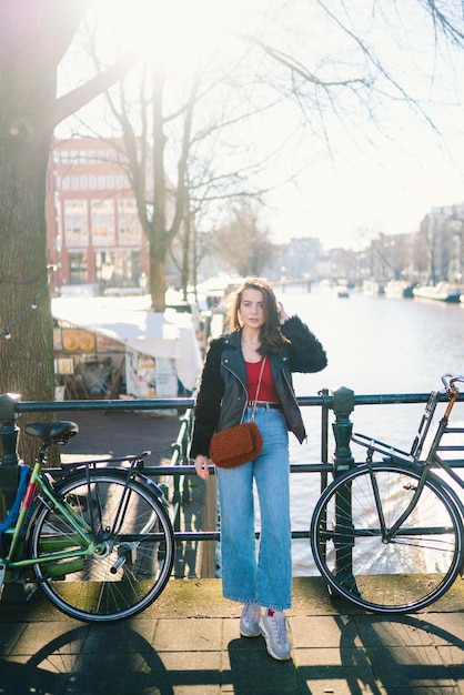 Portrait of a beautiful girl on a sunny day streets of\
amsterdam a girl enjoys her lifestyle