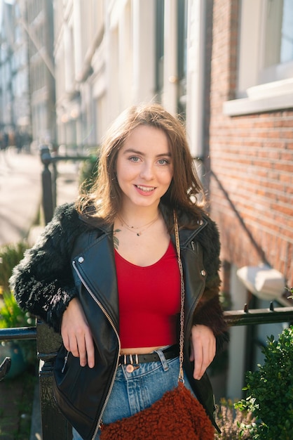 Portrait of a beautiful girl on a sunny day Streets of Amsterdam A girl enjoys her lifestyle