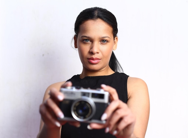 Portrait of a beautiful girl using a video camera