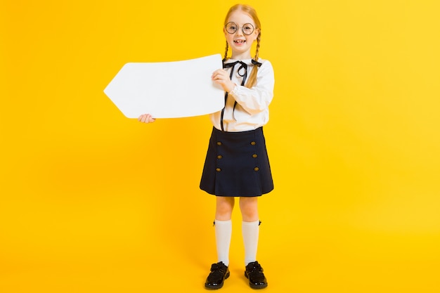 Portrait of a beautiful girl in a white blouse and black skirt.