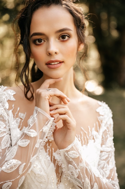 Portrait of a beautiful girl in a white dress