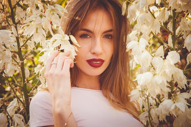 Portrait of a beautiful girl in white flowers bells