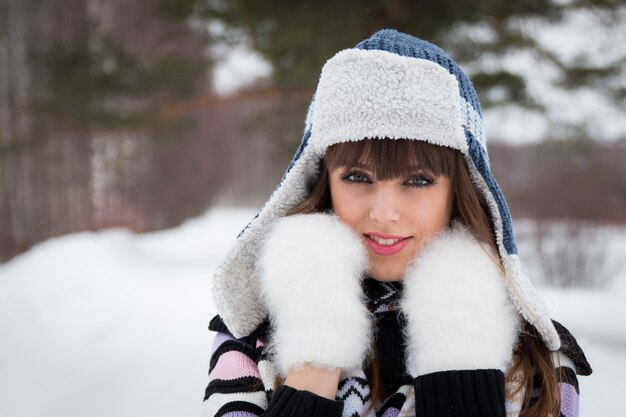 portrait of a beautiful girl in the winter forest